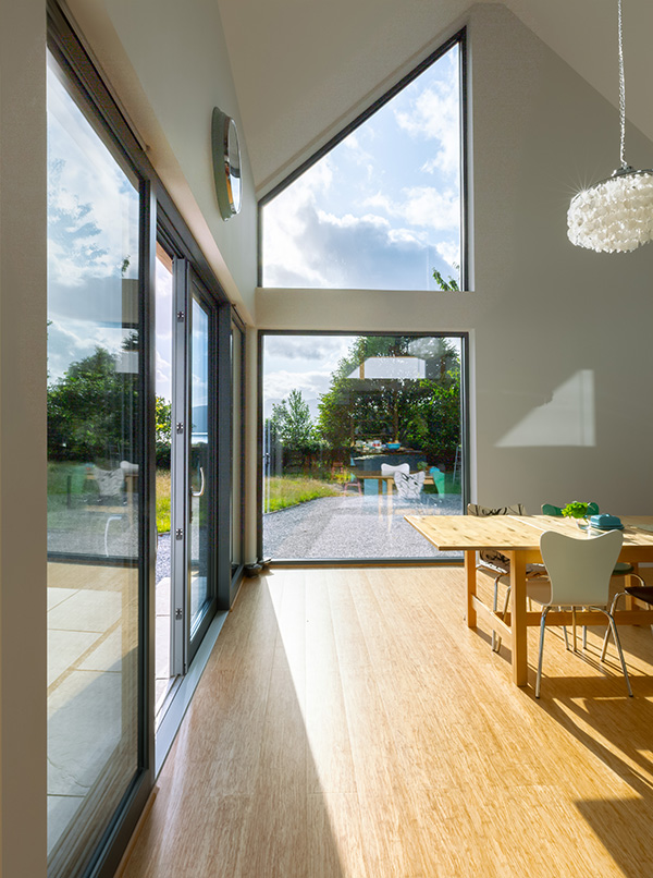 Windows with views from open plan kitchen dining in architect designed extension