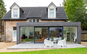glazed architect-designed extension in Bearsden with Staffordshire blue brick